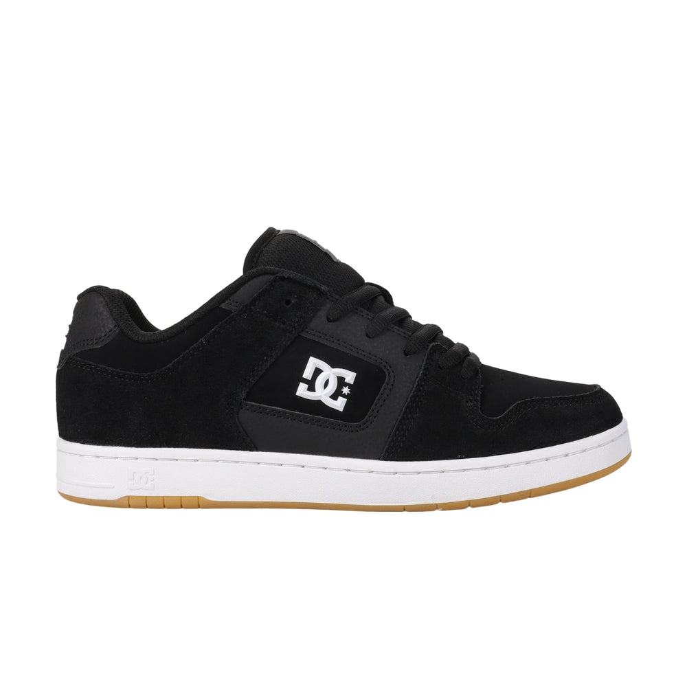 A black DC shoe with white soles.