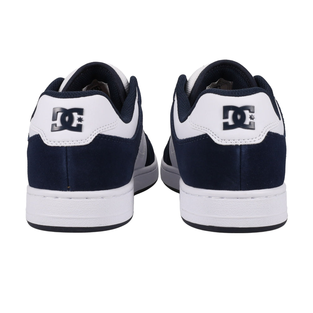 A rear view of a pair of navy and white DC shoes.