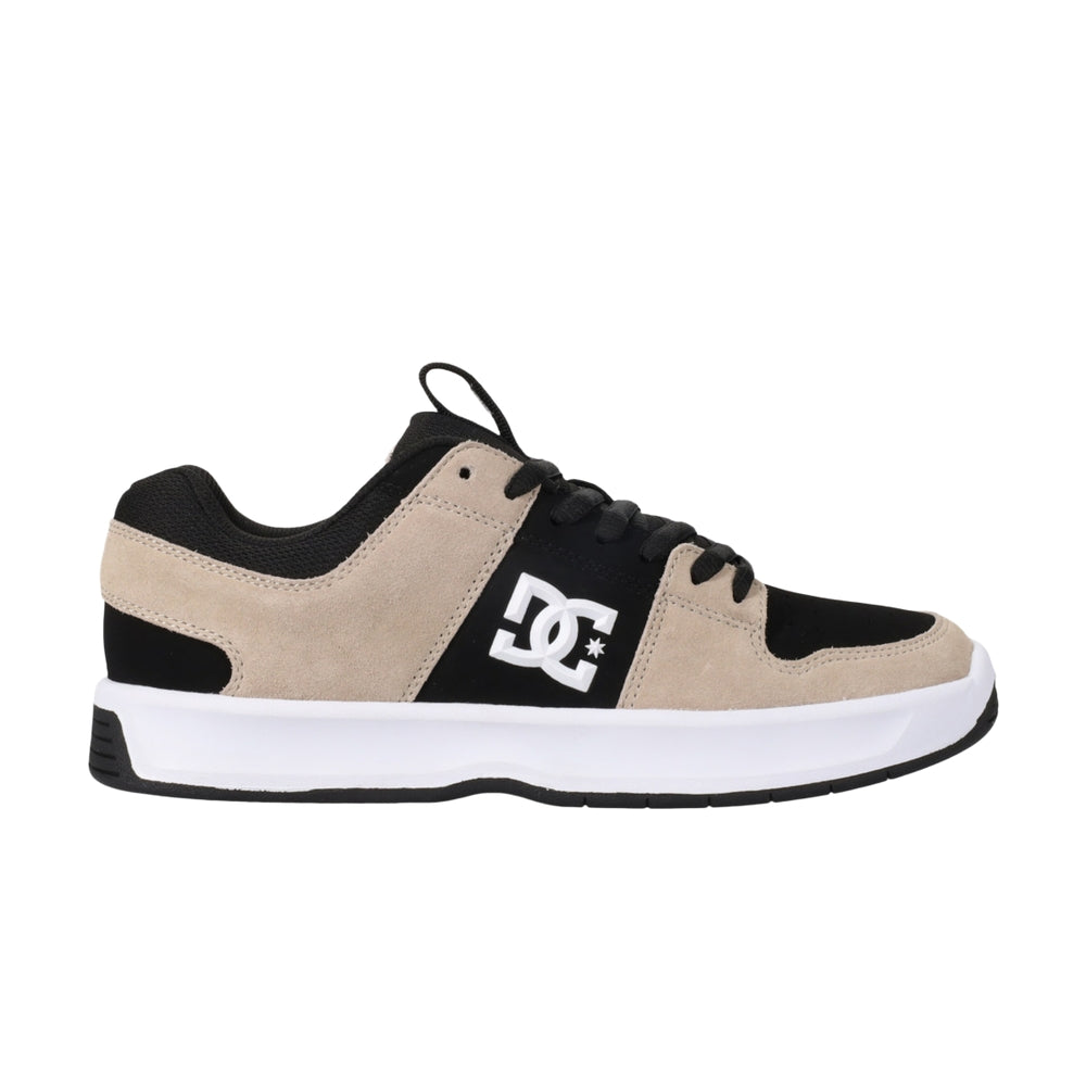 A beige and black shoe with white soles.