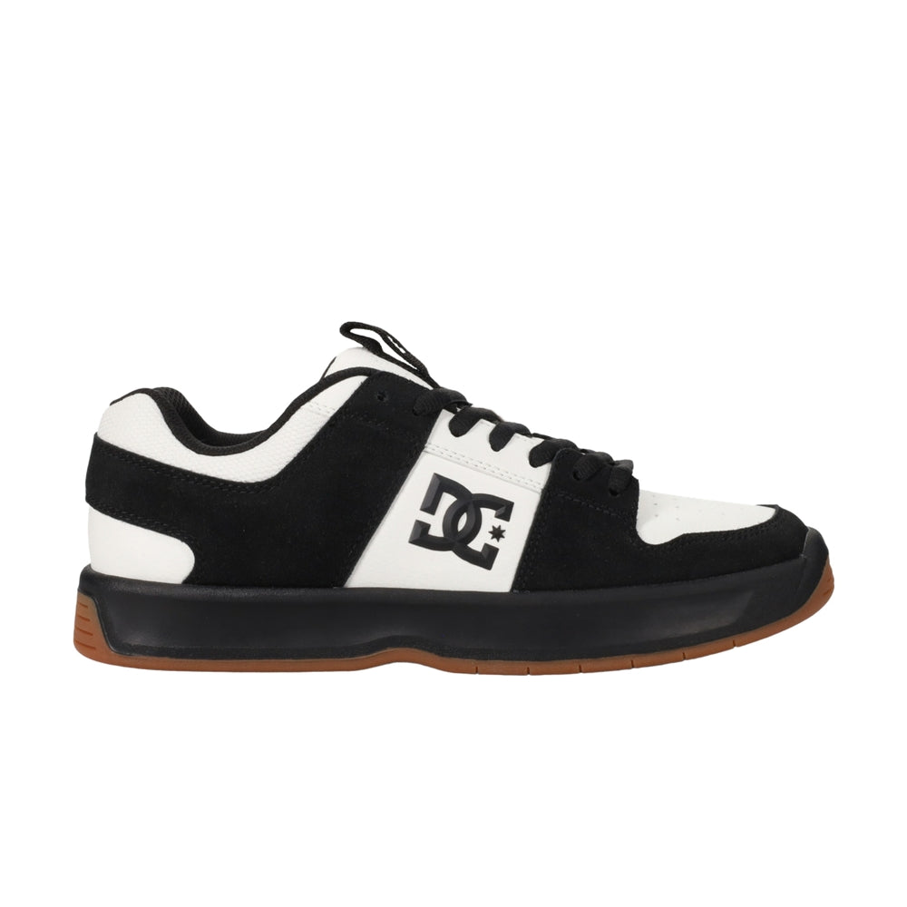 A black and white DC shoe with black soles.