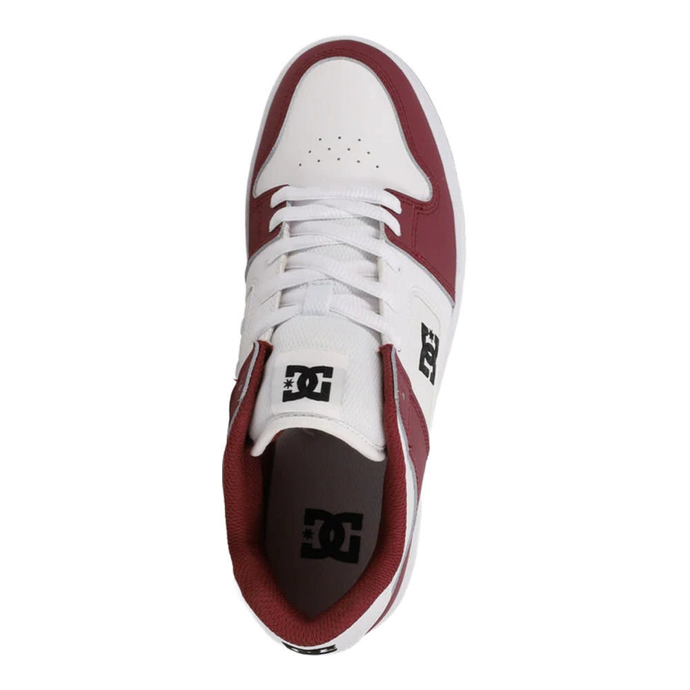 A white and maroon colored DC shoe.