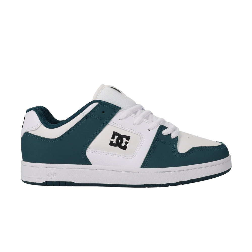 A white DC shoe with green highlights.