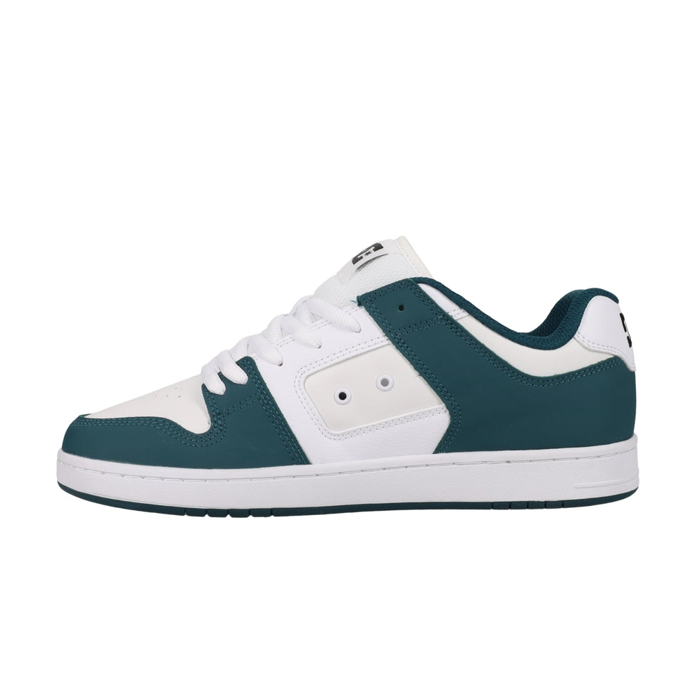 A white DC shoe with green highlights.
