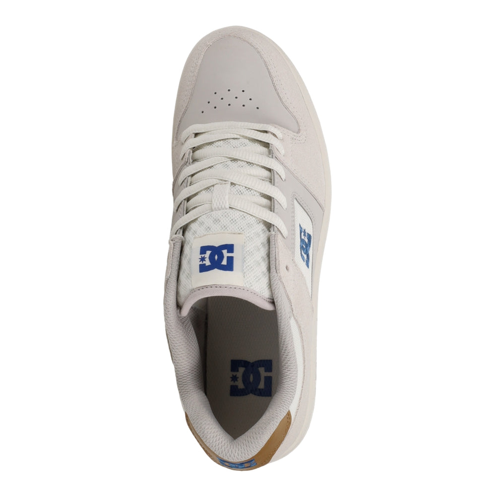 A beige color DC shoes with brown soles.