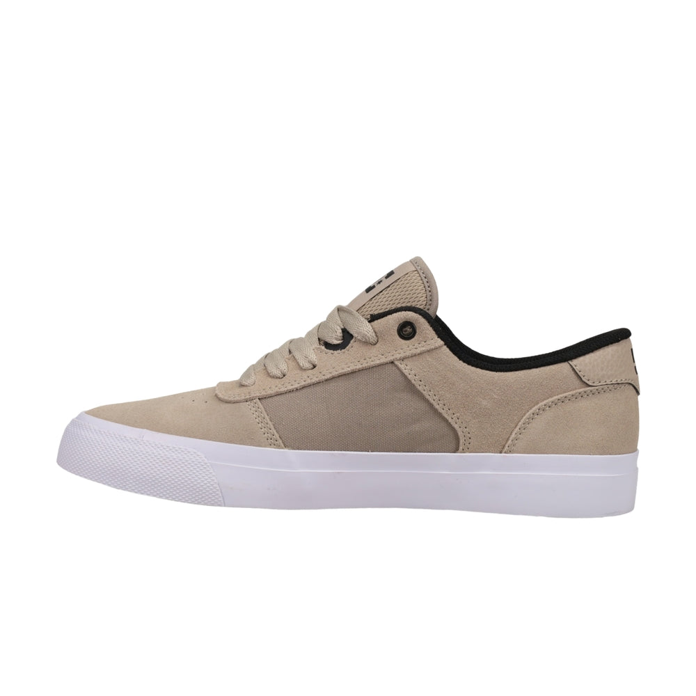 A brown DC shoe with white soles.