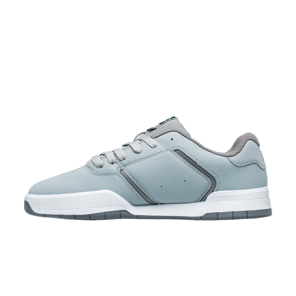 A bluish DC shoe with white and grey soles.