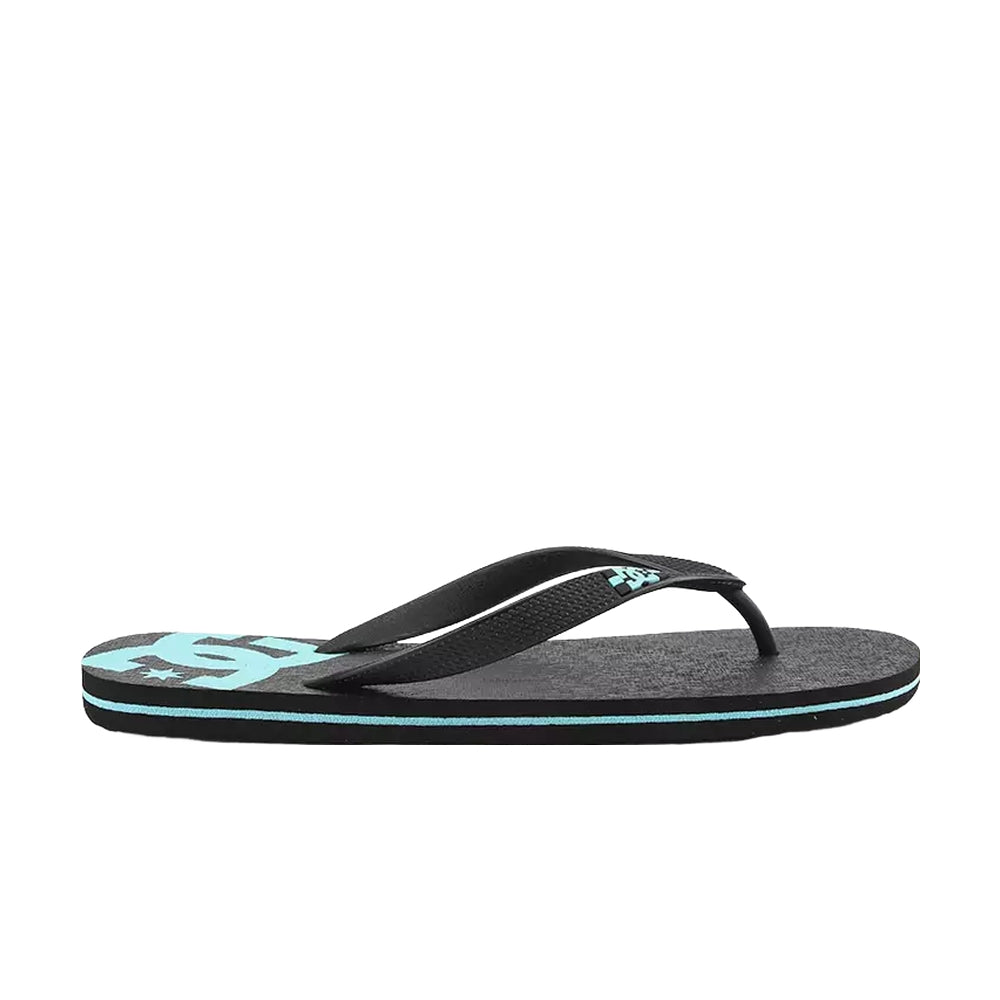 A side view of a black slipper with black straps and light blue DC logo designs.
