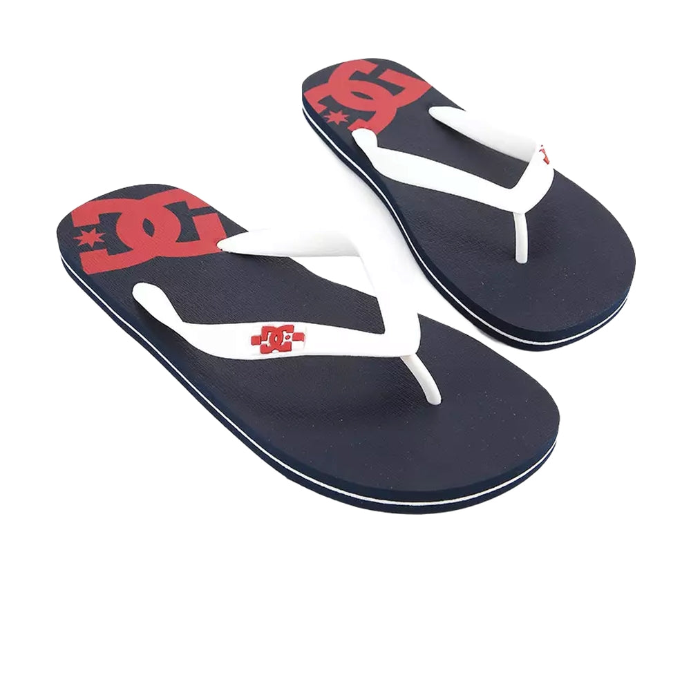 A pair of black slippers with white straps and a red DC logo design.