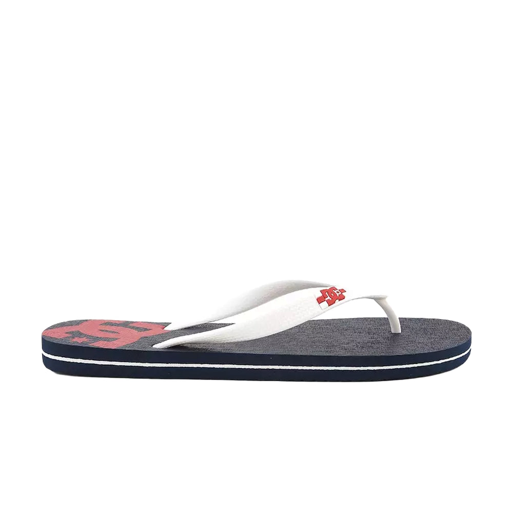 A side view of a black slipper with white straps and a red DC logo design.