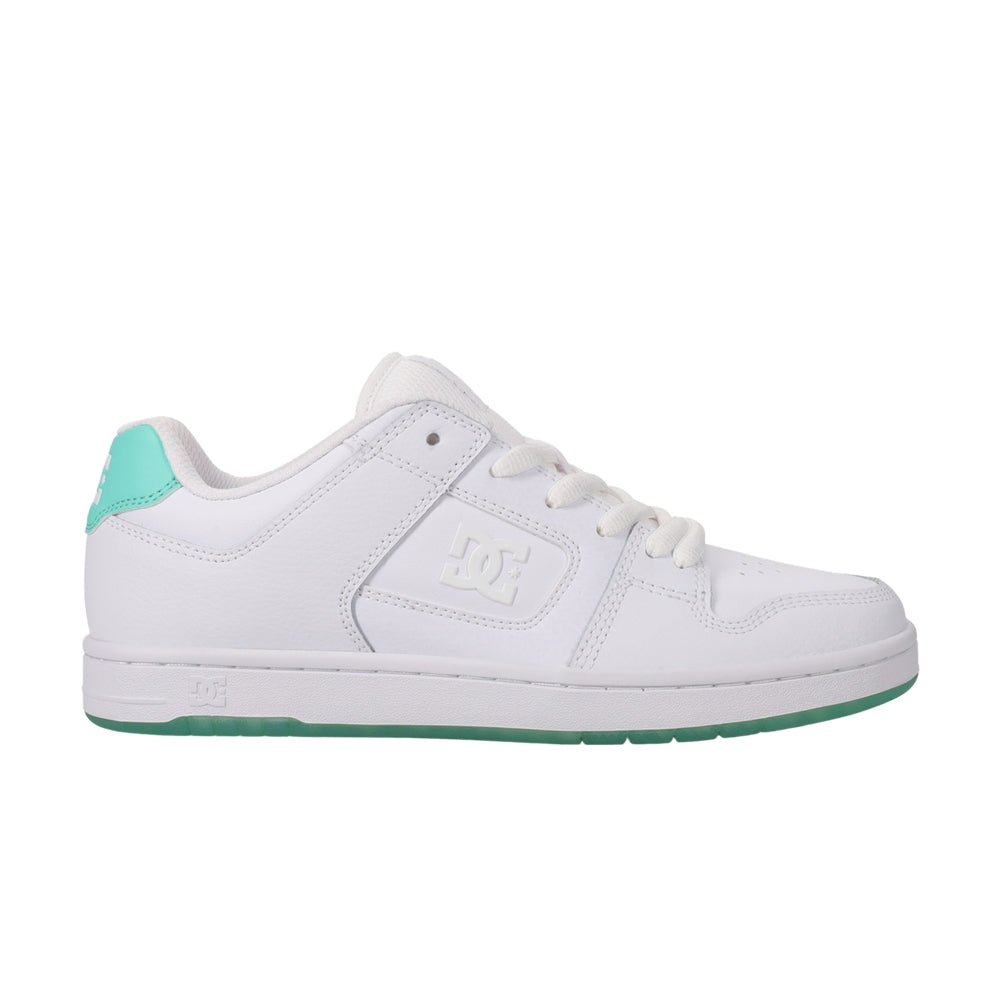A white DC shoe with green soles.